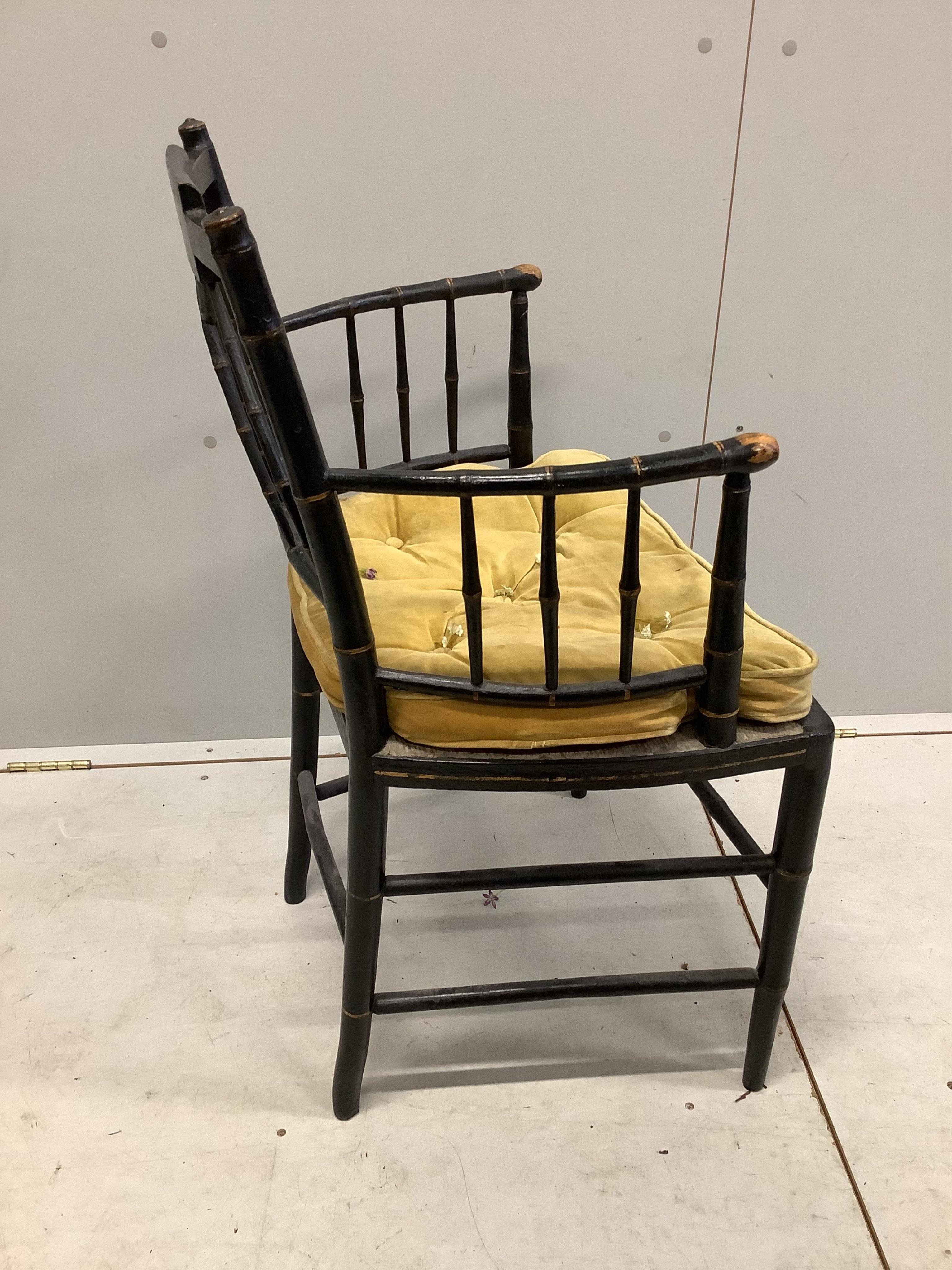 A Regency painted faux bamboo elbow chair, width 52cm, depth 41cm, height 85cm. Condition - fair